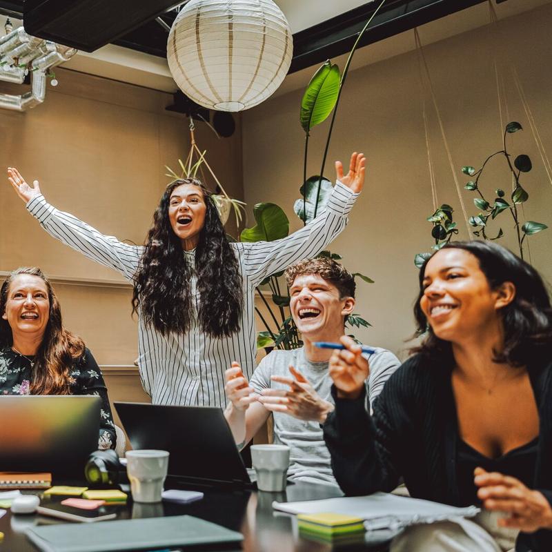 Colleagues celebrate together in office 800