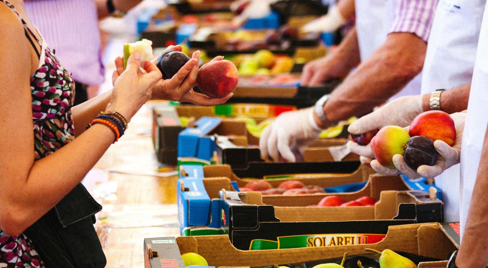 Large Web and Screen Close up of woman buying fruit at a market stall