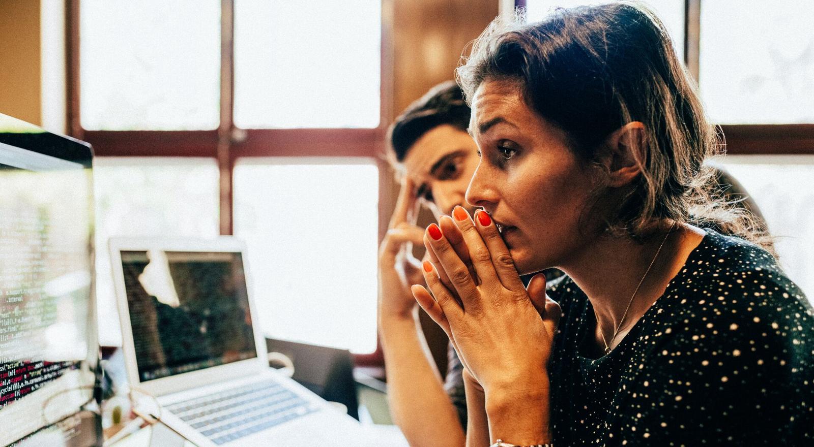Large Web and Screen Woman and man look concentrated to computer screen