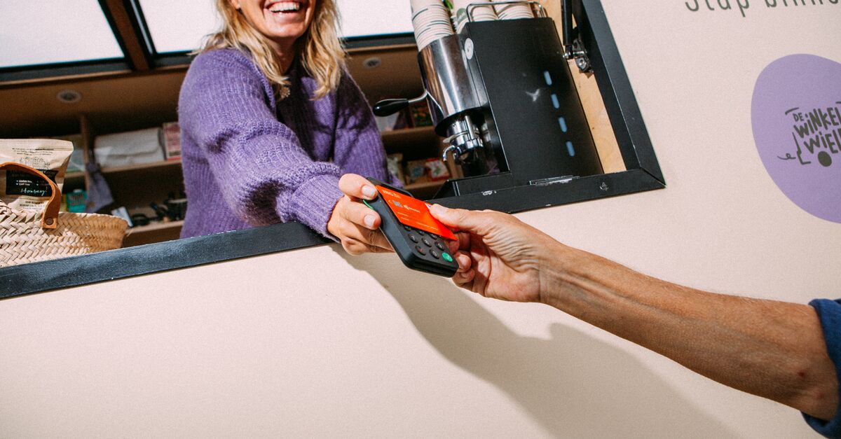 LinkedIn and Facebook A customer holds an ING card on a card reader that the happy female cashier is holding at a food truck