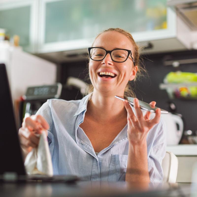 Smiling business woman works from home